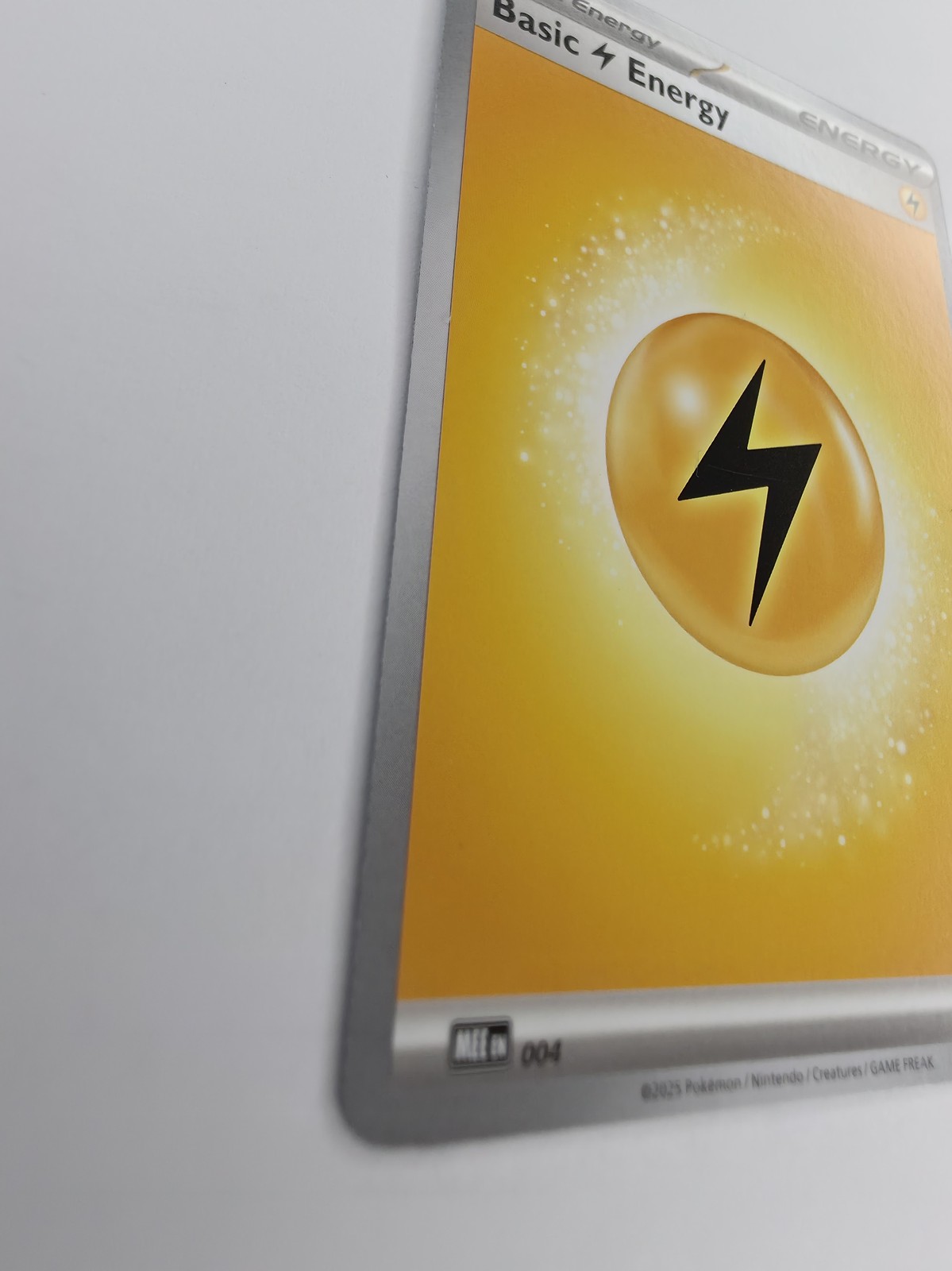 2025 Pokemon Mega Evolution Energies Basic Lightning Energy #004 Common front at an angle