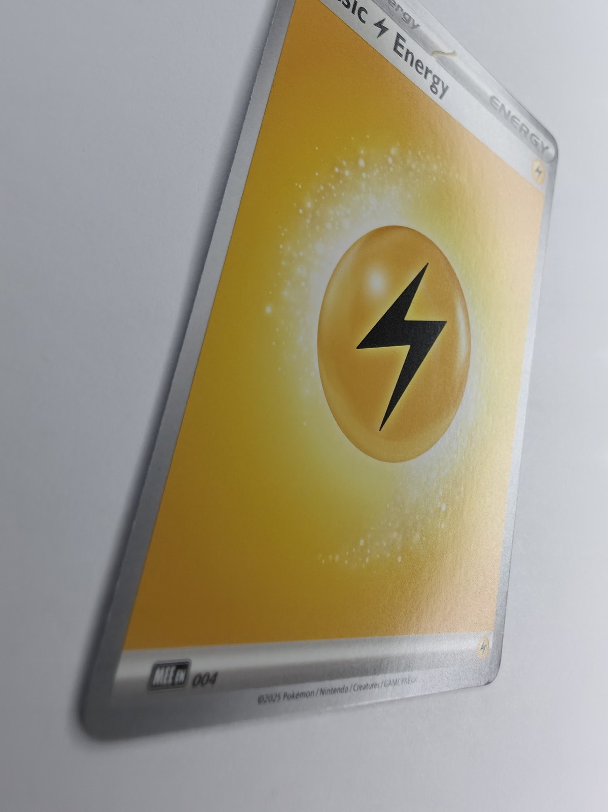2025 Pokemon Mega Evolution Energies Basic Lightning Energy #004 Common front at an angle