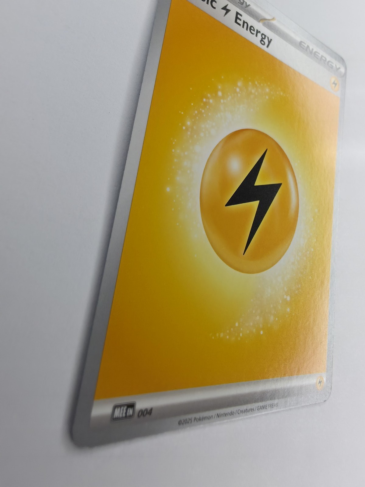 2025 Pokemon Mega Evolution Energies Basic Lightning Energy #004 Common front at an angle