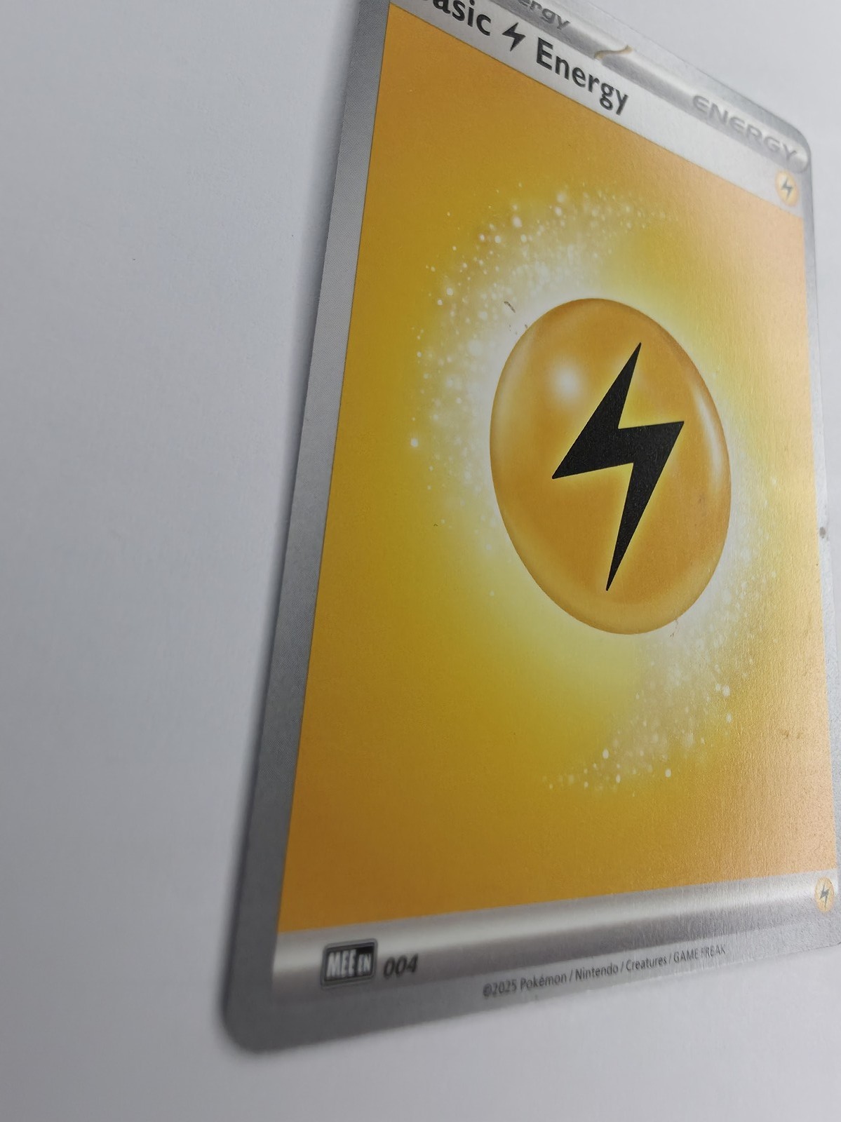 2025 Pokemon Mega Evolution Energies Basic Lightning Energy #004 Common front at an angle