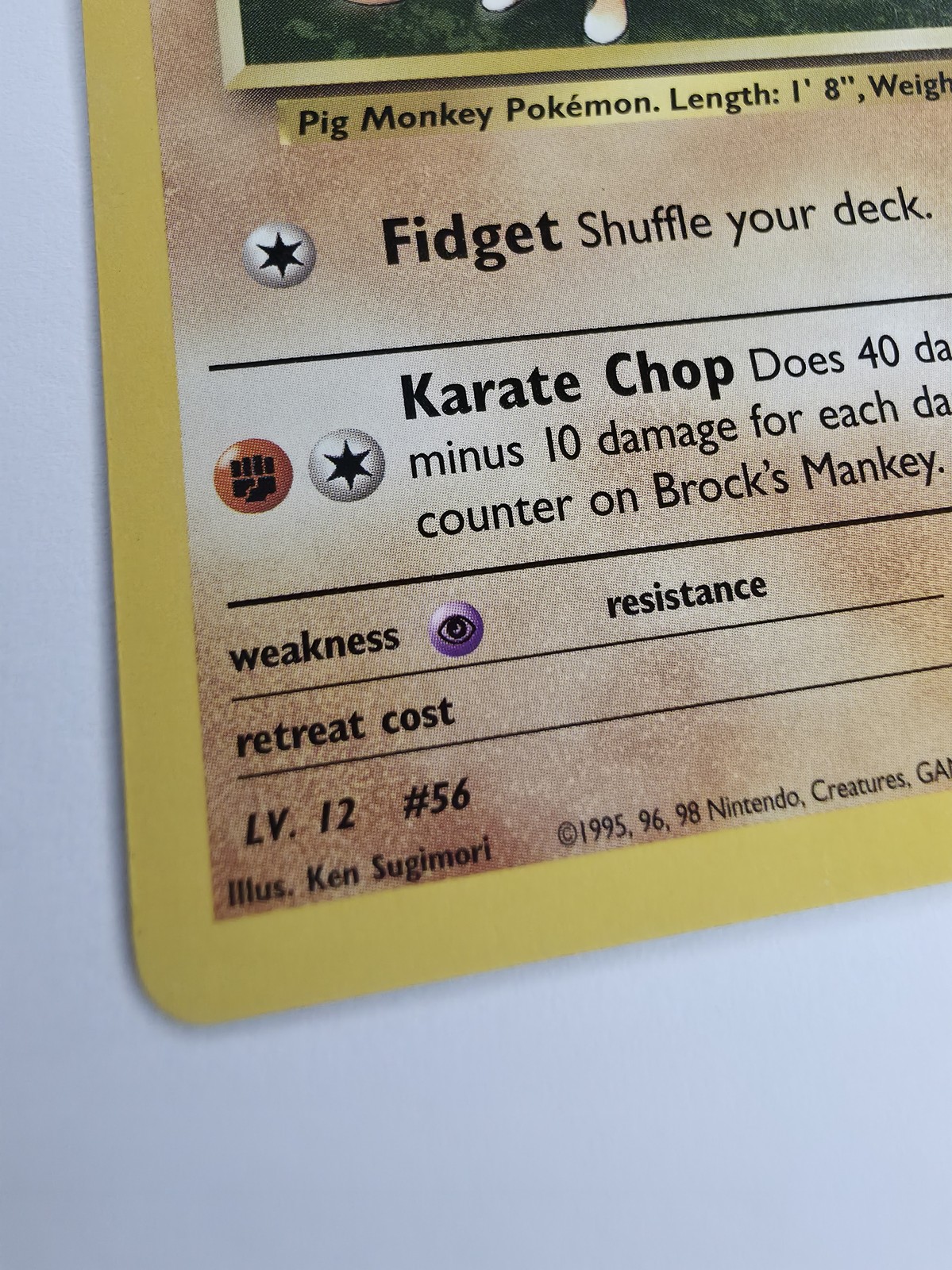 Brock's Mankey, front lower-right text and bottom-left corner, raking