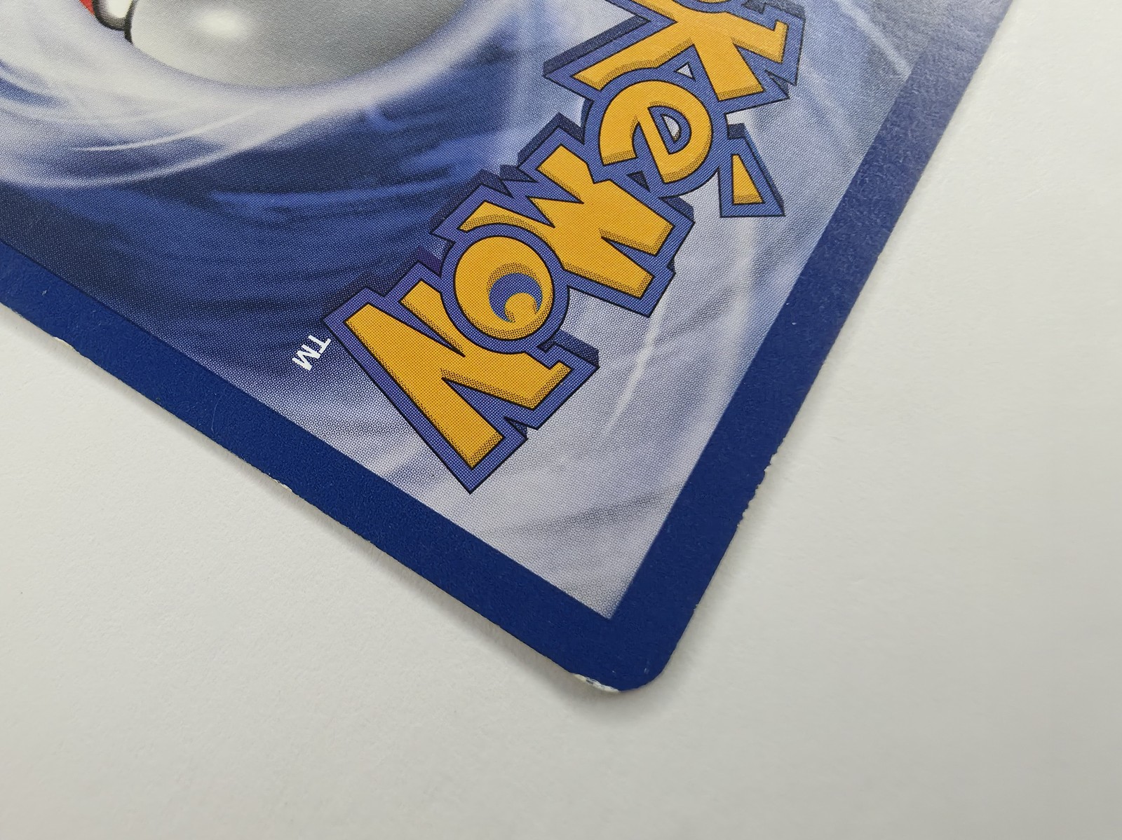 Moltres, back bottom-left corner and lower logo